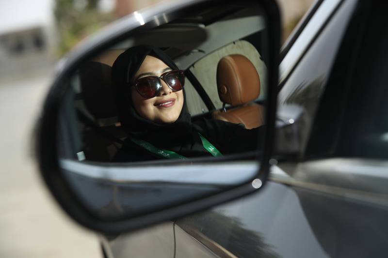 JEDDAH, SAUDI ARABIA - JUNE 24:  Fadya Fahad, 23, one of the first female drivers for Careem, a peer-to-peer ride sharing company similar to Uber, is seen in the driver's side mirror of a car she has rented on the first day she is legally allowed to drive in Saudi Arabia on June 24, 2018 in Jeddah, Saudi Arabia. Fadya lived in the United States, where she got her first license. ÒIt's so amazing,Ó she said of today. When asked what her parents thought about it, she sad: ÒThey are so proud. My father said I drive better than my brother.Ó Saudi Arabia has today lifted its ban on women driving, which had been in place since 1957. The Saudi government, under Crown Prince Mohammad Bin Salman, is phasing in an ongoing series of reforms to both diversify the Saudi economy and to liberalize its society. The reforms also seek to empower women by restoring them basic legal rights, allowing them increasing independence and encouraging their participation in the workforce. Saudi Arabia is among the most conservative countries in the world and women have traditionally had much fewer rights than men.  (Photo by Sean Gallup/Getty Images)