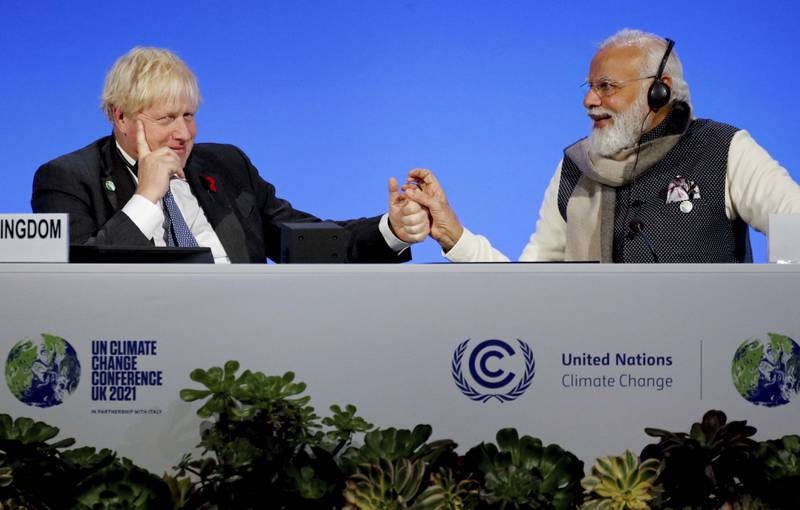 Boris Johnson and India's Prime Minister Narendra Modi bond at a meeting. AP Photo