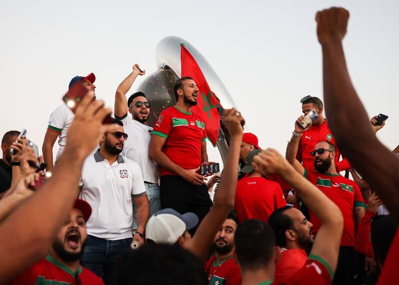 Moroccan football fans at the Corniche waterfront in Doha. Getty 