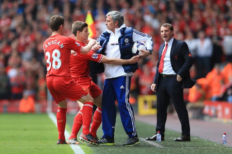 Steven Gerrard of Liverpool tries to retrieve the ball from Chelsea manager Jose Mourinho. 27/04/2014. Simon Stacpoole / FPA / LDY Agency