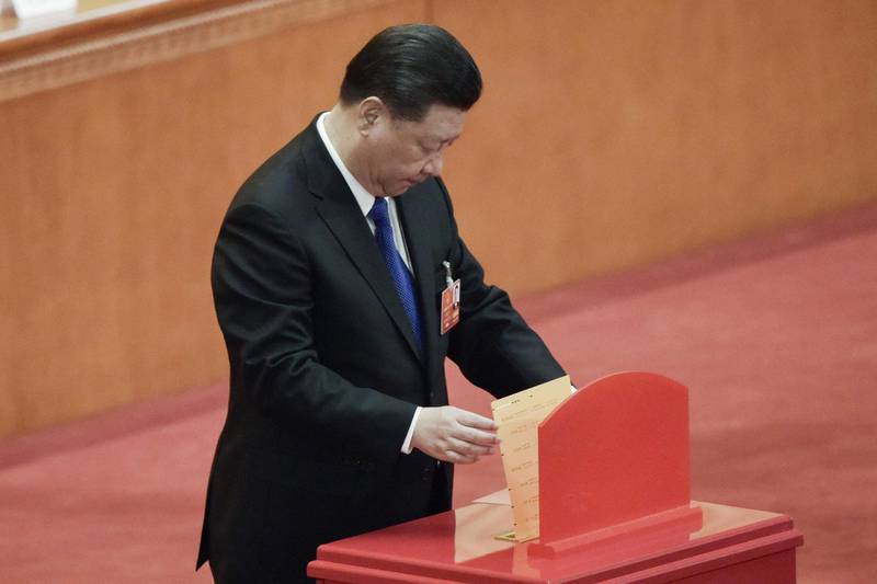 China's President Xi Jinping votes during the sixth plenary session of the National People's Congress (NPC) at the Great Hall of the People in Beijing on March 18, 2018.


China's rubber-stamp parliament unanimously handed President Xi Jinping a second term on March 17 and elevated his right-hand man Wang Qishan to the vice presidency, giving him a strong ally to consolidate power and handle US trade threats. / AFP PHOTO / FRED DUFOUR