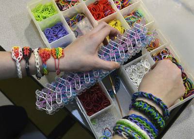 Children use the rubber bands to make charm bracelets and other items of jewellery. Craig Cunningham / AP Photo