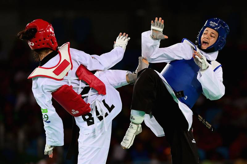 RIO DE JANEIRO, BRAZIL - AUGUST 18:  Hedaya Wahba of Egypt competes against Raheleh Asemani of Belgium during the Women's -57kg Bronze Medal Taekwondo contest at the Carioca Arena on Day 13 of the 2016 Rio Olympic Games on August 18, 2016 in Rio de Janeiro, Brazil.  (Photo by Laurence Griffiths/Getty Images)