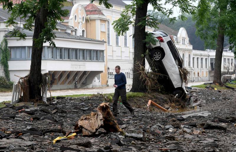 A car was washed away and and came to rest against a tree in Bad Neuenahr-Ahrweiler, western Germany.
