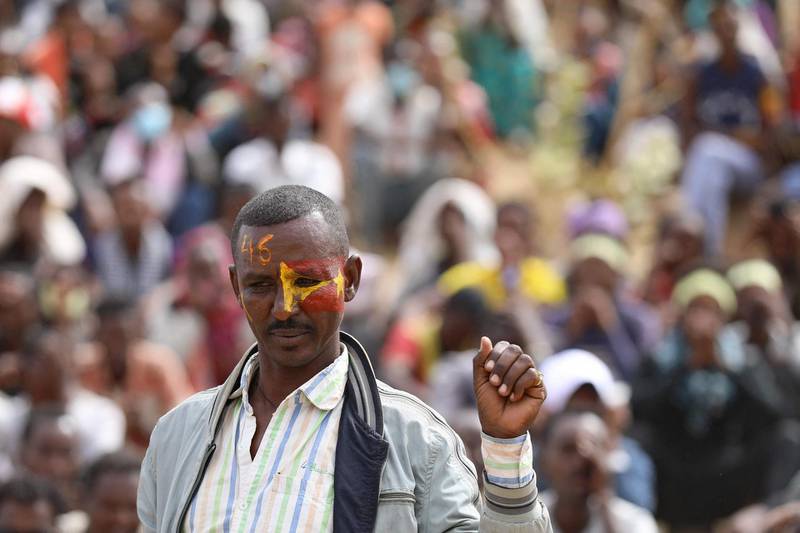 An Ethiopian refugee attends a gathering to celebrate the 46th anniversary of the Tigray People's Liberation Front at Um Raquba refugee camp in Gedaref, eastern Sudan, on February 19, 2021. In remote eastern Sudan, refugee activists are keeping the flame burning for the former rebels who dominated Ethiopian politics before being ousted from their regional stronghold of Tigray last year. / AFP / Hussein Ery
