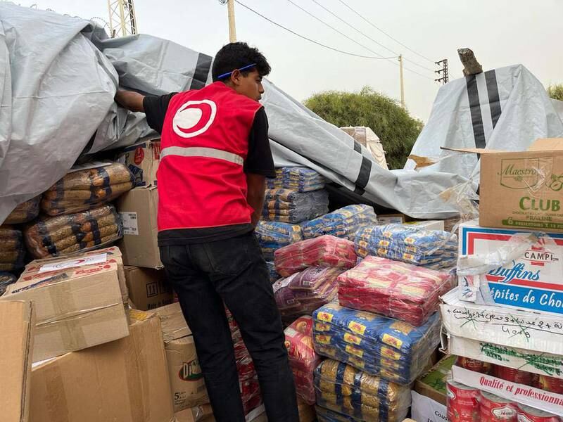 Tunisian Red Crescent volunteers at central headquarters collecting and organising donations for people in Gaza. Ghaya Ben Mbarek / The National