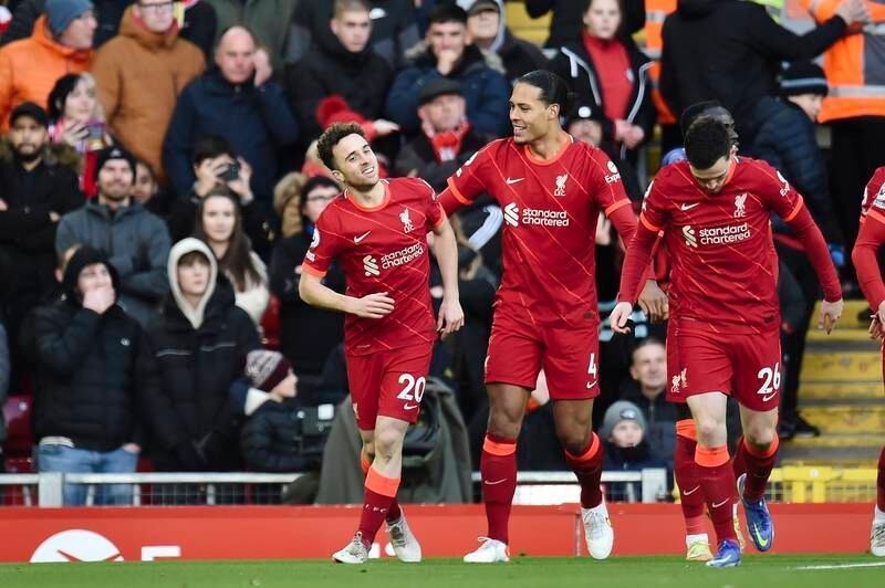 Liverpool's Diogo Jota, left, celebrates with teammates after opening the scoring. EPA