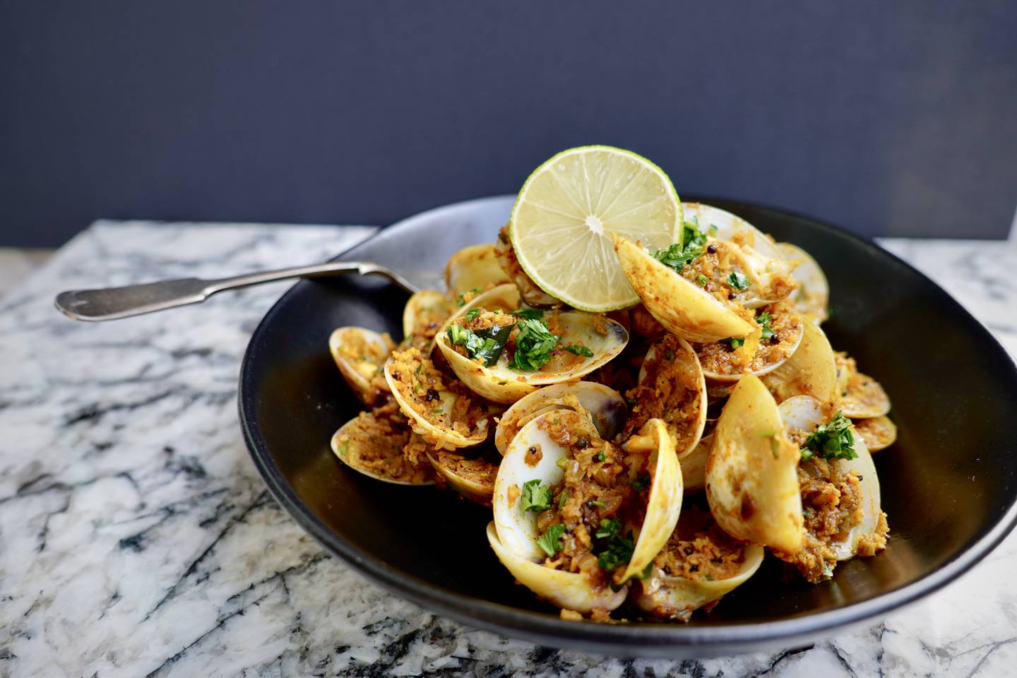 Slow stir-fried Kerala clams. Photo: Nicole Barua