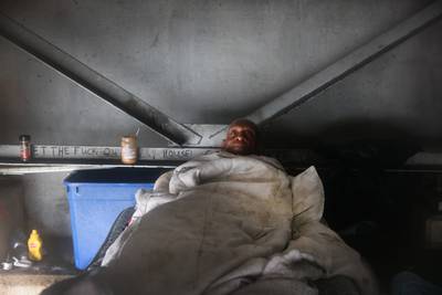 Michael Brown, who is homeless, rides out Hurricane Ida from his bed under a highway overpass in New Orleans. AFP