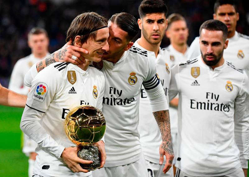 Real Madrid  midfielder Luka Modric shows off his Ballon d'Or trophy before the Primera Liga match against Rayo Vallecano. AFP