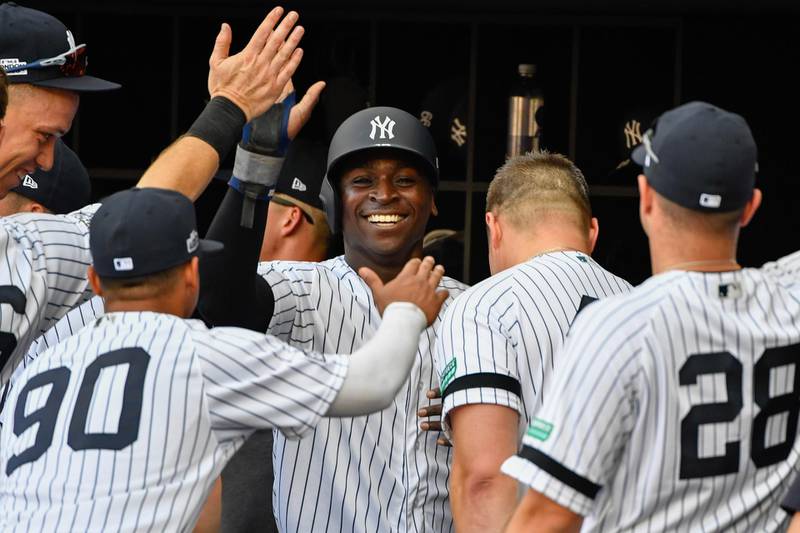 London, ENG; New York Yankees shortstop Didi Gregorius (18) celebrates his run with his team mates during the first inning against the Boston Red Sox at London Stadium. Mandatory Credit: Steve Flynn-USA TODAY Sports