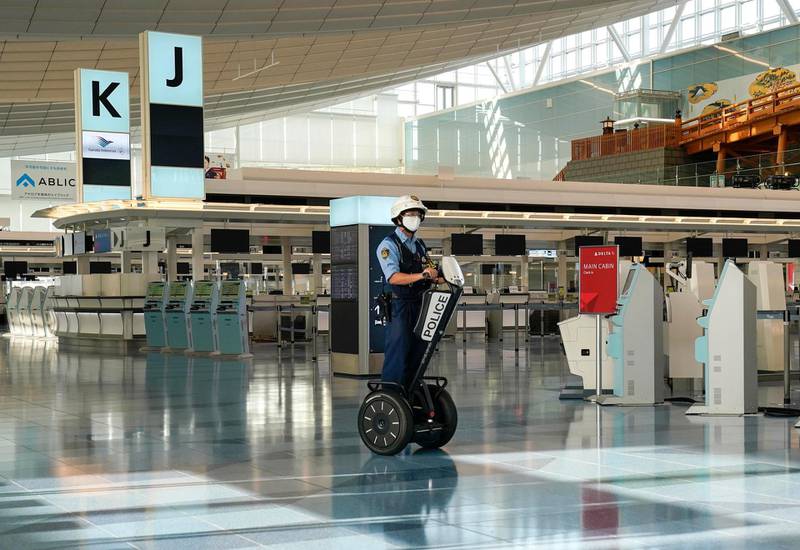A policeman on a Segway patrols on the departure floor at Tokyo International Airport after Japan started easing entry restrictions to visitors from around the world. EPA