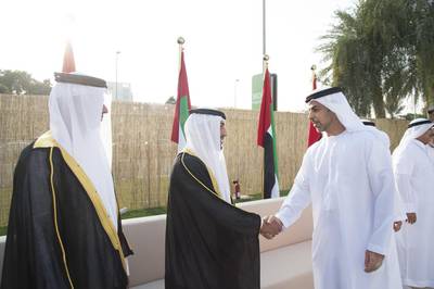 Sheikh Omar bin Zayed, Deputy Chairman of the Board of Trustees of Zayed bin Sultan Al Nahyan Charitable and Humanitarian Foundation, greets a groom. Mohamed Al Suwaidi / Crown Prince Court - Abu Dhabi