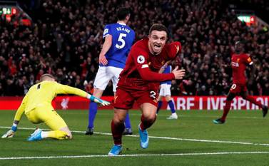 Liverpool's Xherdan Shaqiri celebrates scoring against Everton. Reuters