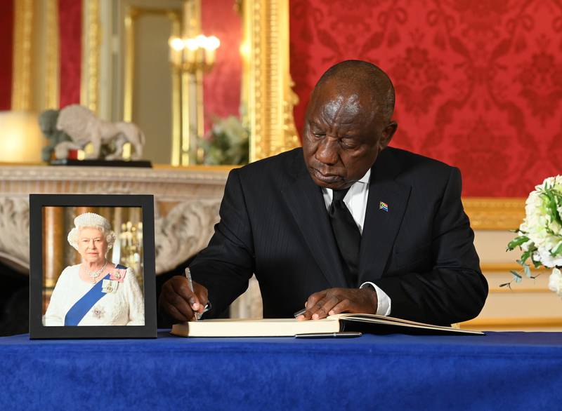 South African President Cyril Ramaphosa signs a book of condolence at Lancaster House in London on September 18, after the death of Queen Elizabeth II. PA