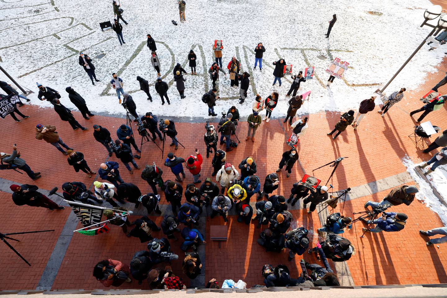 Protesters and media members gather awaiting an outcome in the manslaughter trial of Kimberly Potter, outside the Hennepin County Courthouse in Minneapolis, Minnesota. Reuters