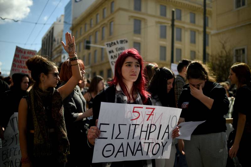 A placard in Greek about the rail tragedy reads '57 tickets for death'. AFP