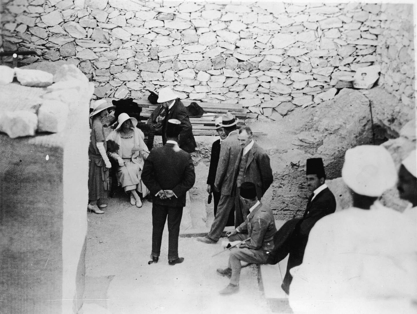 Queen Elisabeth of Belgium, seated, at the tomb of Pharaoh Tutankhamun on February 18, 1923. Getty