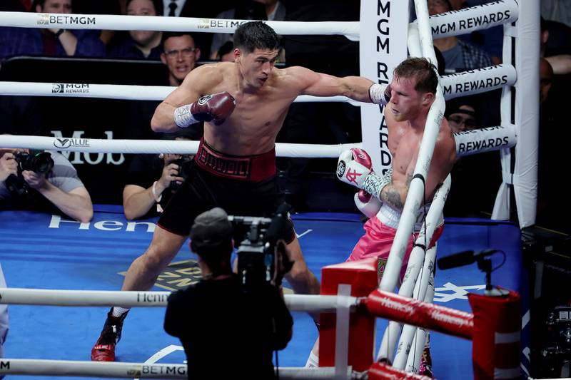Dmitry Bivol throws a left at Canelo Alvarez during their WBA light heavyweight title fight at T-Mobile Arena.