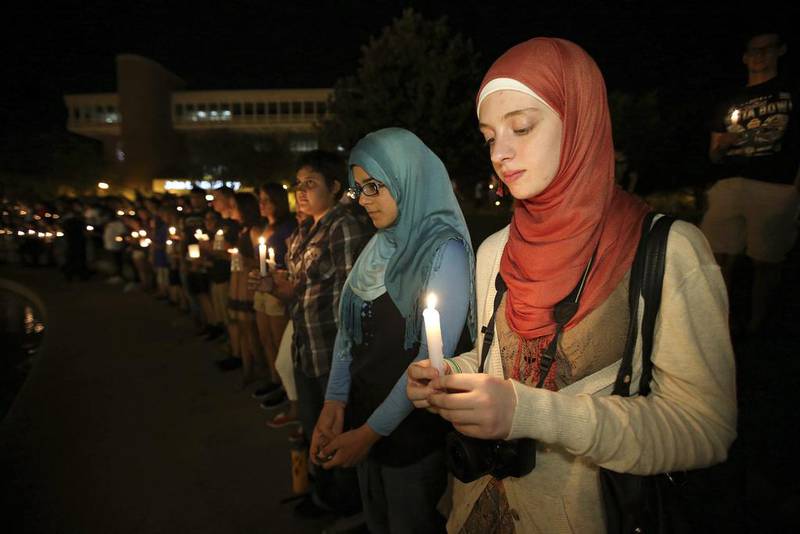 University of Central Florida students hold lit candles during a candlelight vigil in memory of American freelance journalist Steven Sotloff at the University of Central Florida in Orlando, Florida, USA on September 3, 2014. Sotloff was executed by the ISIL militants according to a video released by the group on a day earlier. He was a former student at the university.  Alex Menendez/EPA