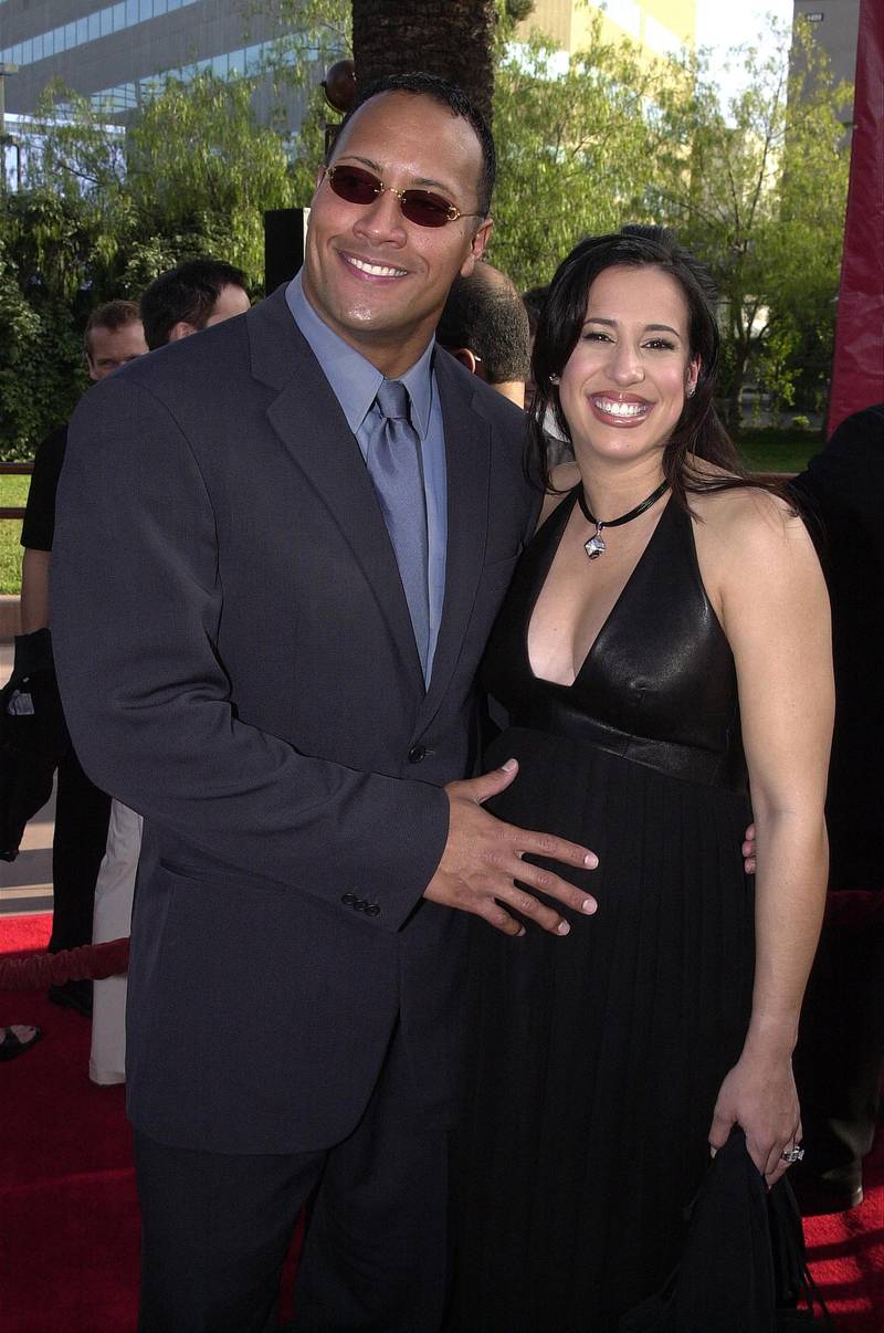 388411 15: Wrestler and actor The Rock and pregnant wife Dani attend the premiere of the film "The Mummy Returns" April 29, 2001 at Universal Studios in Burbank, CA. (Photo by Vince Bucci/Newsmakers)