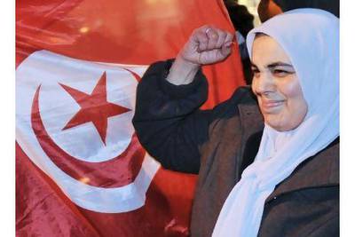 A woman celebrates after the announcement that the fallen Tunisian president Zine el Abidine Ben Ali has left the country. A reader provides some historical background to the street protests in Tunisia.