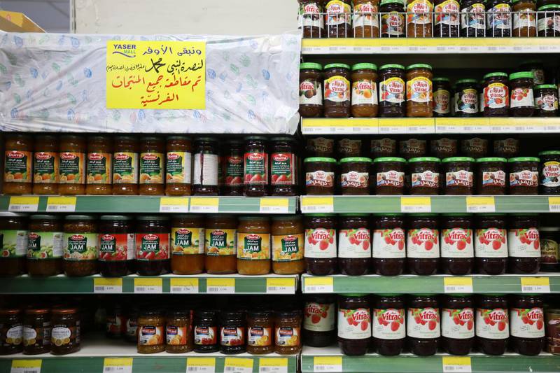 A sign covers French products in protest against French cartoons of the Prophet Mohammed at a shopping mall in Amman, Jordan. The banner reads in Arabic 'In solidarity with the Prophet Mohammed peace be upon him, all French products have been boycotted'. Reuters