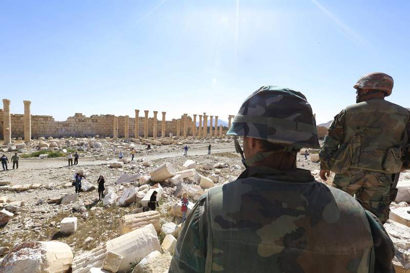 Syrian soldiers examine ISIL’s destruction at the historical Bel Temple in Palmyra after retaking the ancient city town from the extremist group. AP Photo / April 1, 2016.