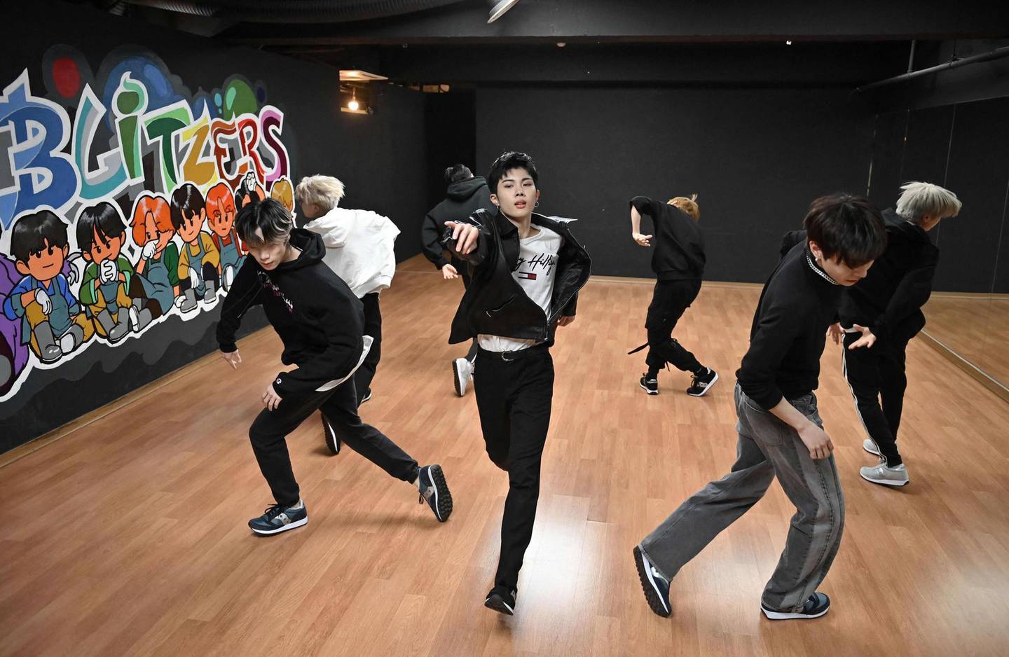 This picture taken on April 29, 2021 shows members of the K-pop boy band Blitzers performing during their dance practise session at a rehearsal studio in Seoul. Thirty teenagers, thousands of hours of training, dozens of shattered dreams: it all comes to a head next week when the Blitzers will be launched into the cut-throat K-pop market, hoping to become the next BTS. - TO GO WITH SKorea-music-social-entertainment-Kpop,FOCUS by Kang Jin-kyu
 / AFP / Jung Yeon-je / TO GO WITH SKorea-music-social-entertainment-Kpop,FOCUS by Kang Jin-kyu
