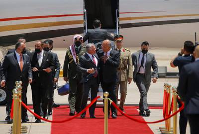 Iraqi President Barham Salih receives King Abdullah II of Jordan at Baghdad International Airport. Reuters