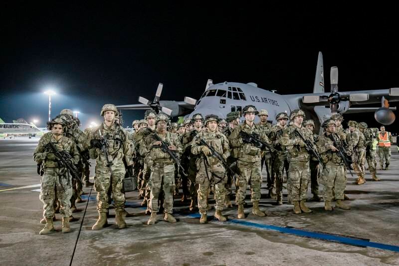 The first 40 soldiers of the 173rd US Army Airborne Brigade step off a military plane in Latvia. EPA