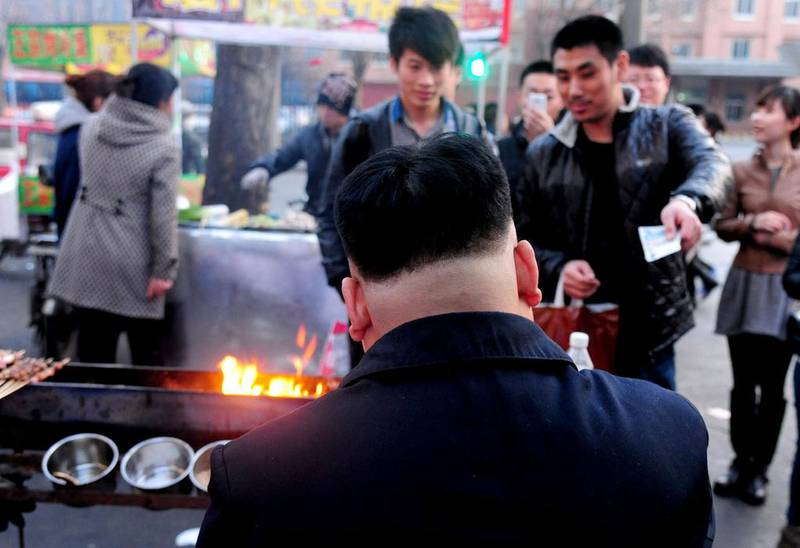 Chubby, with a round face and sporting Kim’s trademark side-shaved haircut, the vendor was pictured cooking skewered meat on a rusty barbecue. AFP Photo