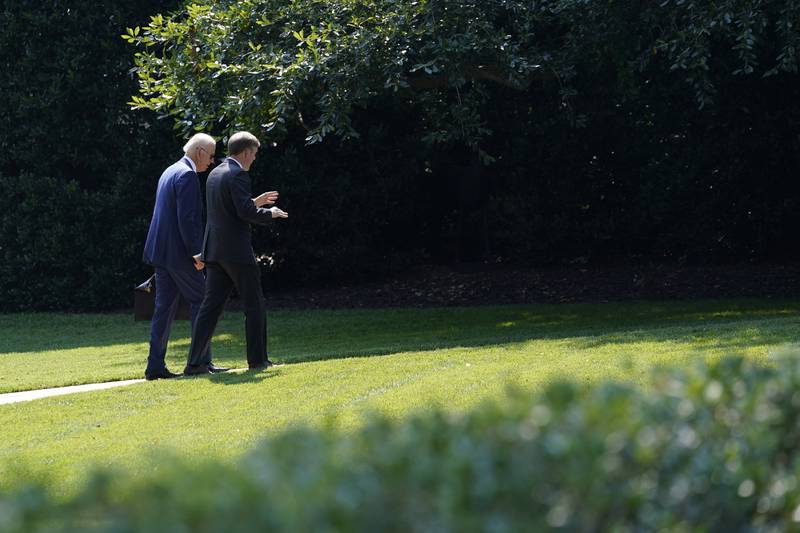 US President Joe Biden, left, walks back to the Oval Office with National Security Adviser Jake Sullivan in Washington. AP Photo