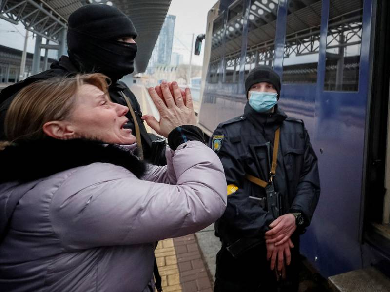 A woman reacts as a train carrying children from Kyiv's Central Children's Hospital leaves the Ukrainian capital on its way to Lviv. Reuters