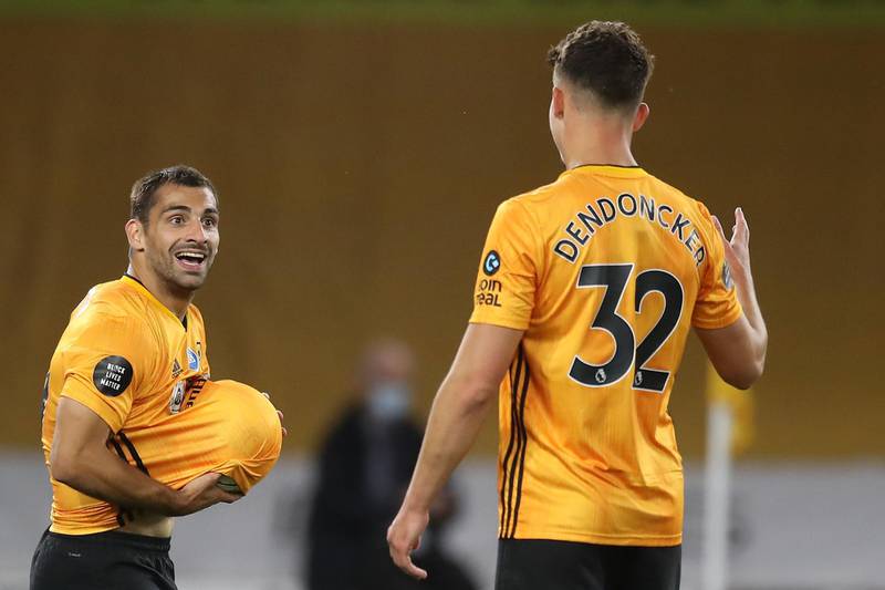 Wolverhampton Wanderers' Spanish defender Jonny Otto (L) celebrates scoring his team's second goal during the English Premier League football match between Wolverhampton Wanderers and Crystal Palace at the Molineux stadium in Wolverhampton, central England  on July 20, 2020. RESTRICTED TO EDITORIAL USE. No use with unauthorized audio, video, data, fixture lists, club/league logos or 'live' services. Online in-match use limited to 120 images. An additional 40 images may be used in extra time. No video emulation. Social media in-match use limited to 120 images. An additional 40 images may be used in extra time. No use in betting publications, games or single club/league/player publications.
 / AFP / POOL / Martin Rickett / RESTRICTED TO EDITORIAL USE. No use with unauthorized audio, video, data, fixture lists, club/league logos or 'live' services. Online in-match use limited to 120 images. An additional 40 images may be used in extra time. No video emulation. Social media in-match use limited to 120 images. An additional 40 images may be used in extra time. No use in betting publications, games or single club/league/player publications.
