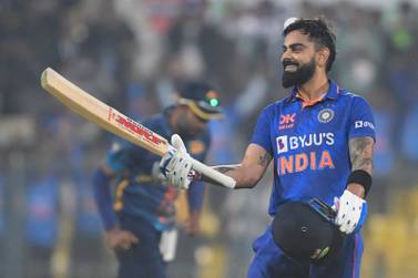 India's Virat Kohli (R) celebrates after scoring a century (100 runs) during the first one-day international (ODI) cricket match between India and Sri Lanka at the Assam Cricket Association Stadium in Guwahati on January 10, 2023.  (Photo by Dibyangshu SARKAR  /  AFP)  /  ----IMAGE RESTRICTED TO EDITORIAL USE - STRICTLY NO COMMERCIAL USE-----