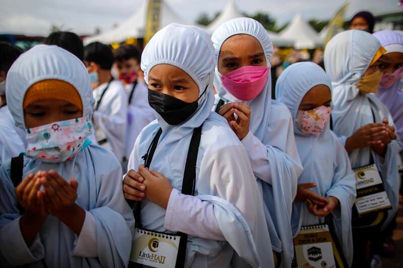 Children pray during Little Hajj 2022 in Serdang, outside Kuala Lumpur, Malaysia.
