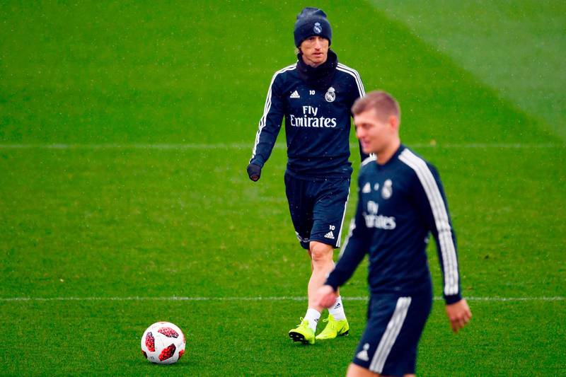 Real Madrid midfielders Luka Modric, background, and Toni Kroos. AFP
