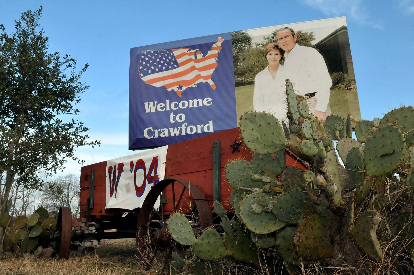 Crawford, Texas -- Jan. 10, 2009 -- A sign featuring First Lady Laura Bush (left) and President George W. Bush (right) welcomes visitors to Crawford, Texas. (Mark M. Hancock for The National)
