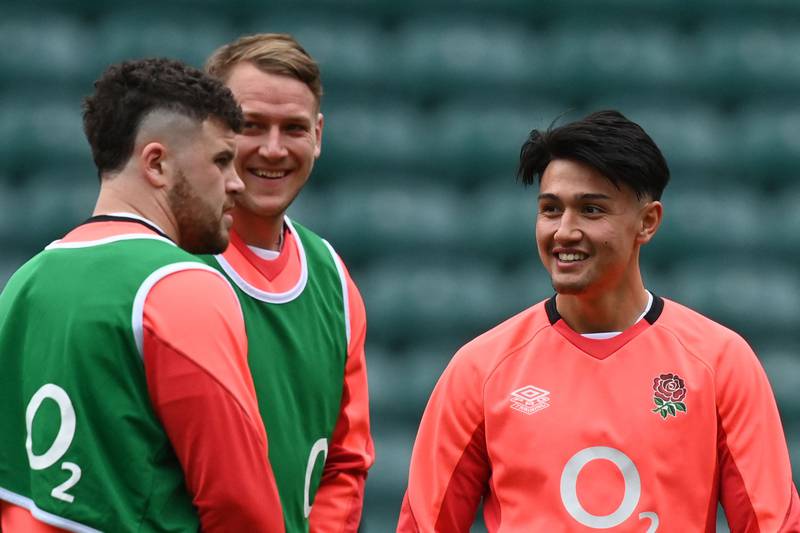 England fly-half Marcus Smith, right, during a team training session at Twickenham. AFP