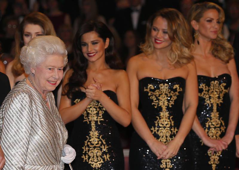 Members of the band Girls Aloud smile as Queen Elizabeth attends the Royal Variety Performance in 2012. Getty Images