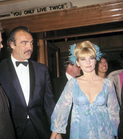 Sean Connery, who plays James Bond in 'You Only Live Twice' arriving with his wife, actress Diane Cilento, for the premiere of the film at the Odeon, Leicester Square.