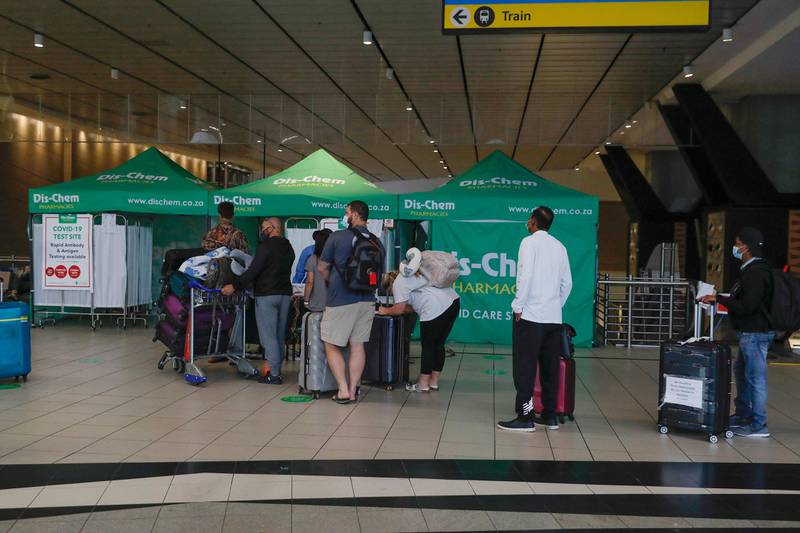 Travellers queue for PCR tests at OR Tambo International Airport in Johannesburg after several countries banned flights from South Africa following the discovery of the Omicron coronavirus variant. AFP