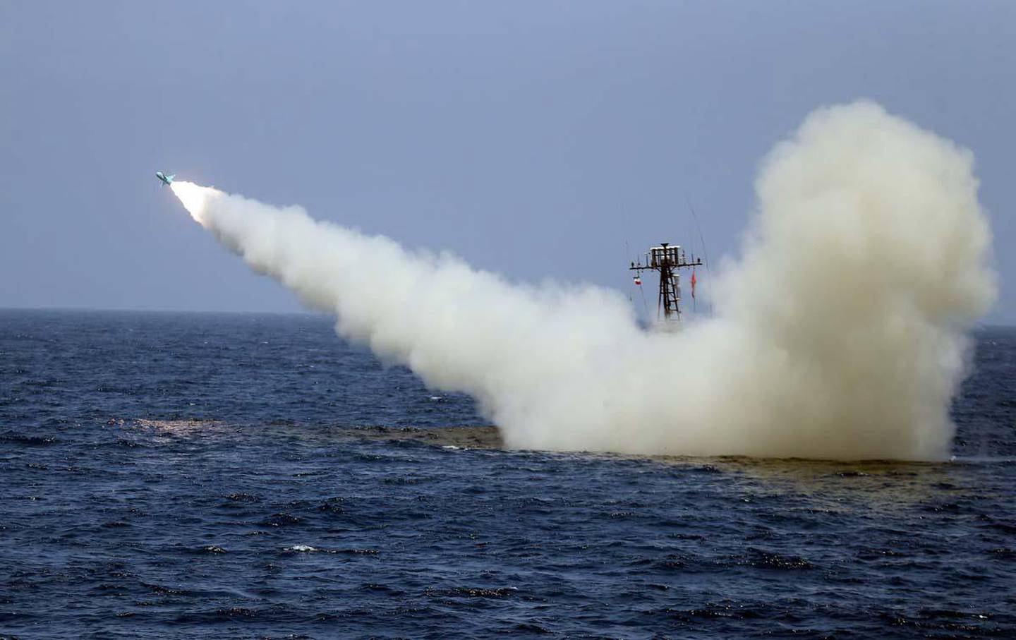 epa08493432 A handout photo made available by the Iranian Army ministry office shows a missile being fired from a war ship during a military exercise in the Gulf of Oman, Iran, 18 June 2020. According to reports, Iran on 18 June 2020 said it successfully tested 'new generation' of cruise missiles during exercise.  EPA/IRANIAN ARMY OFFICE HANDOUT  HANDOUT EDITORIAL USE ONLY/NO SALES