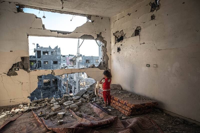 A young Palestinian girl in what was once her family home in Beit Hanun, northern Gaza, on May 24. Getty