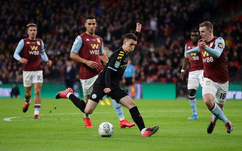 Manchester City midfielder Phil Foden takes on Aston Villa full-back Matt Targett during the League Cup final. Reuters