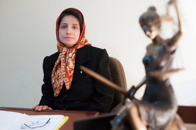 In this Nov. 1, 2008 photo, Iranian human rights lawyer Nasrin Sotoudeh, poses for a photograph in her office in Tehran, Iran. On Wednesday, March 6, 2019, the New York-based Center for Human Rights in Iran, said Sotoudeh, a prominent human rights lawyer in Iran who defended women protesting against the Islamic Republic's mandatory headscarf, has been convicted and faces years in prison.  Sotoudeh, who previously served three years in prison for her work, was convicted in absentia by a Revolutionary Court. She is currently held at Tehran's Evin prison. (AP Photo/Arash Ashourinia)