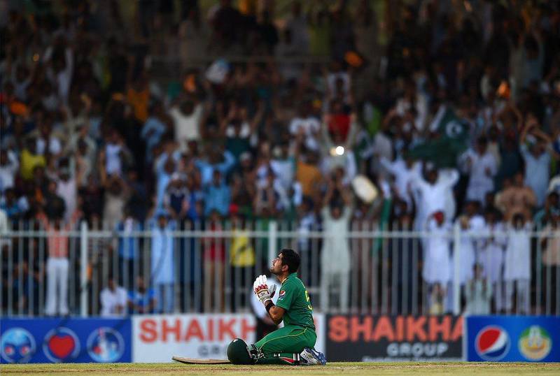 Babar Azam of Pakistan celebrates scoring 100 during the first ODI against West Indies in Sharjah on Friday. Tom Dulat / Getty Images / September 30, 2016