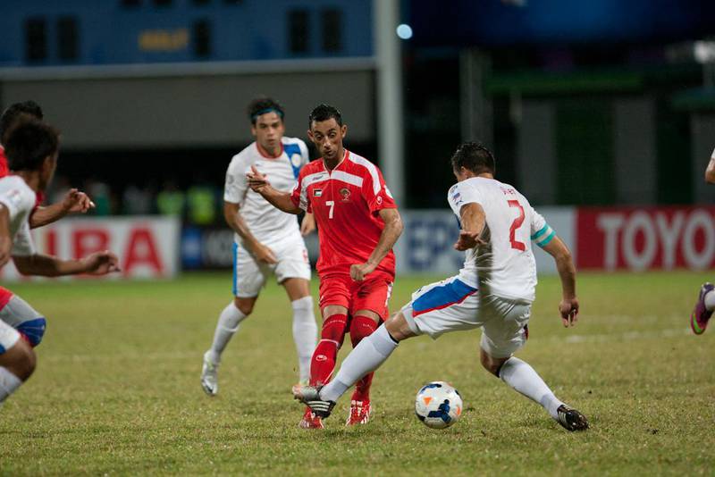 Palestine's Ashraf Al Fawaghra, centre, gets a pass off against Rob Gier of the Philippines durign the AFC Challenge Cup final on Friday night in the Maldives. Courtesy World Sports Group