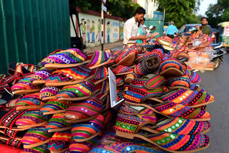 Decorative traditional footwear on sale for Navratri in Ahmedabad. AFP